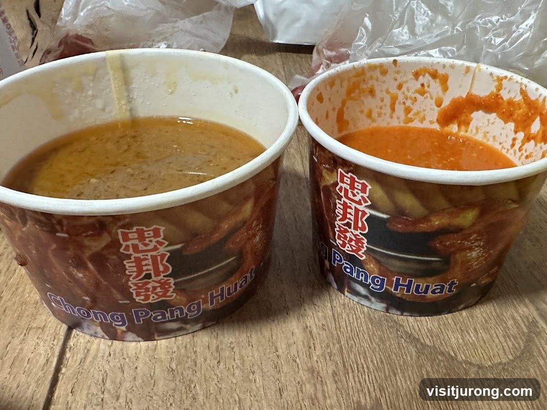 Two containers of sauce