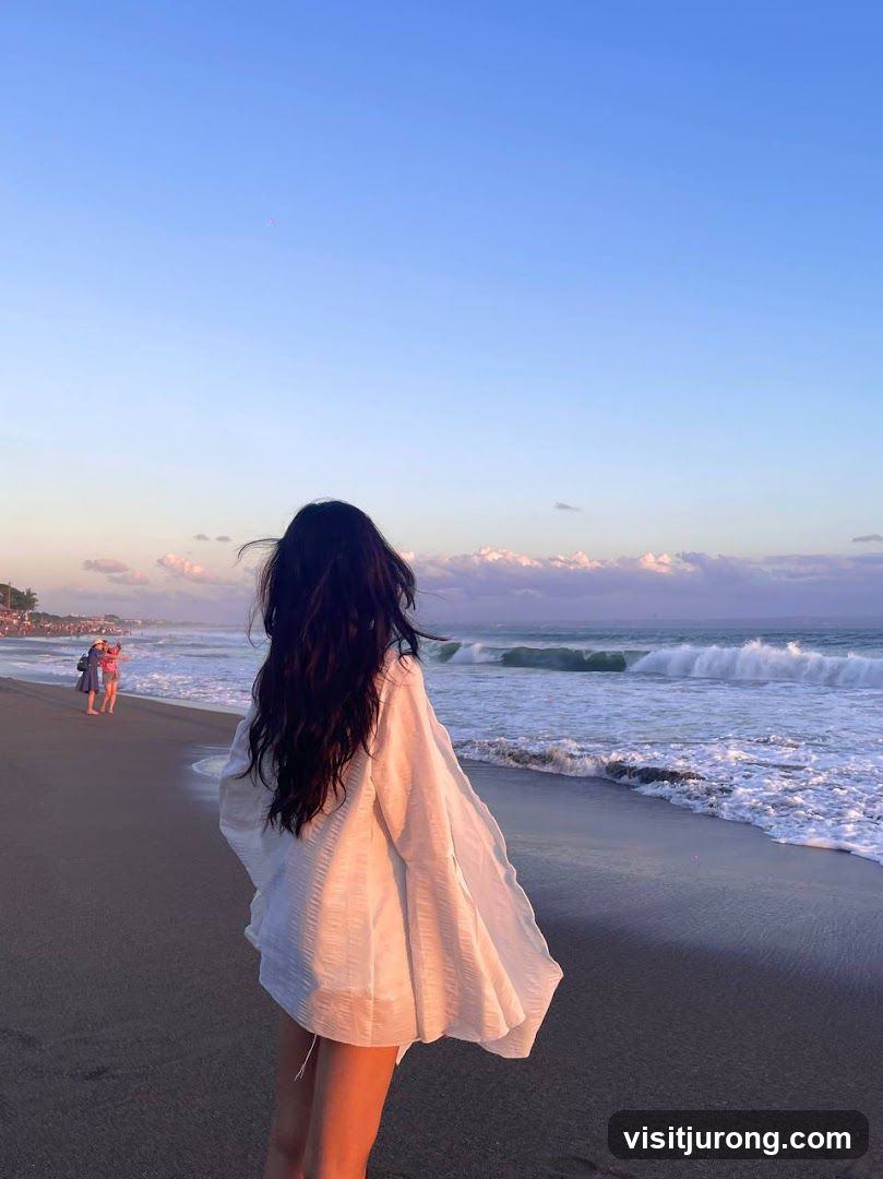 Woman on beach at sunset