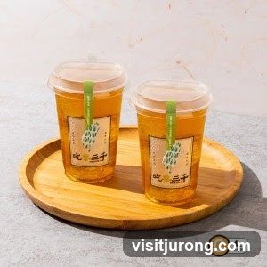 Two cups of iced tea on a wooden tray