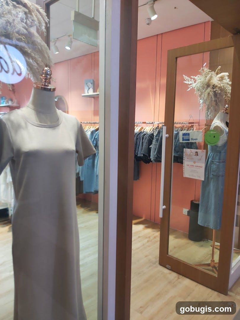 Clothing store interior with mannequins and clothing racks