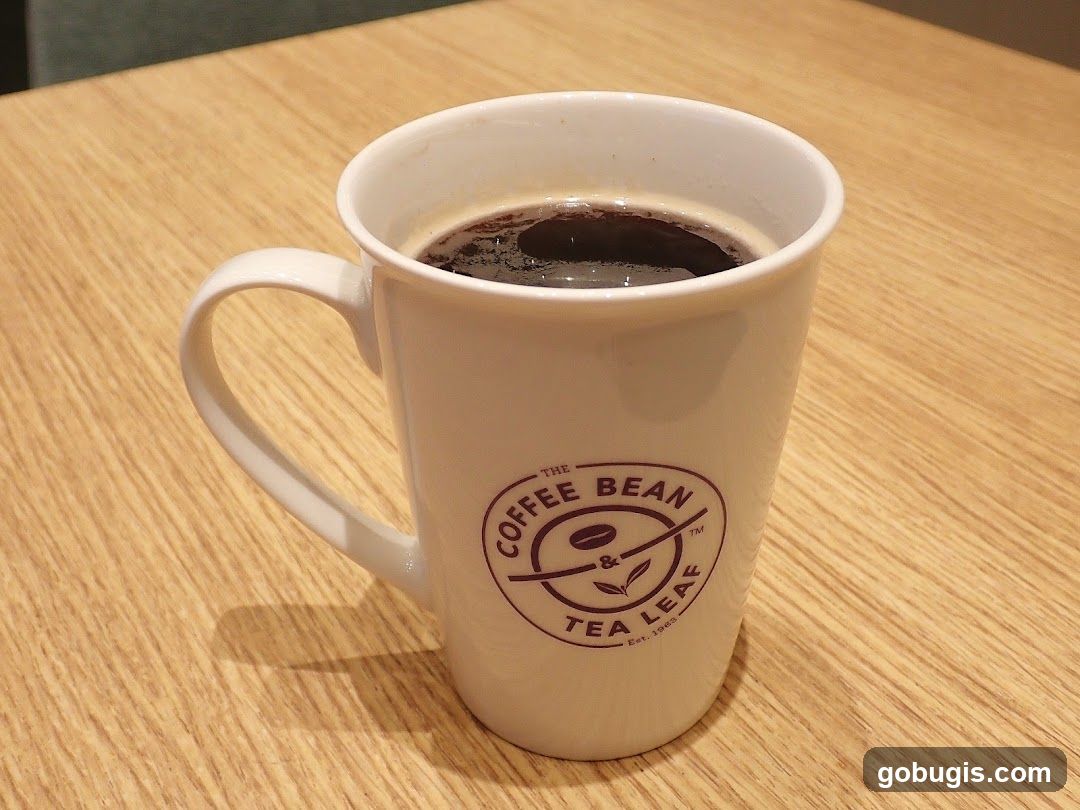 Beverage in a branded cup