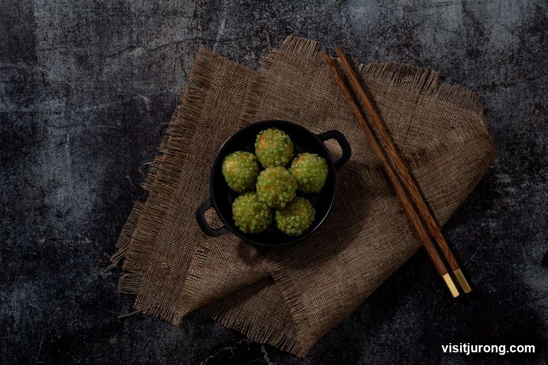 Green dessert balls with chopsticks