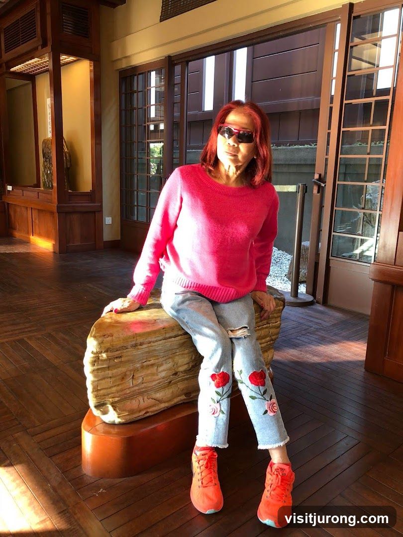 Woman in Pink Sweater and Embroidered Jeans
