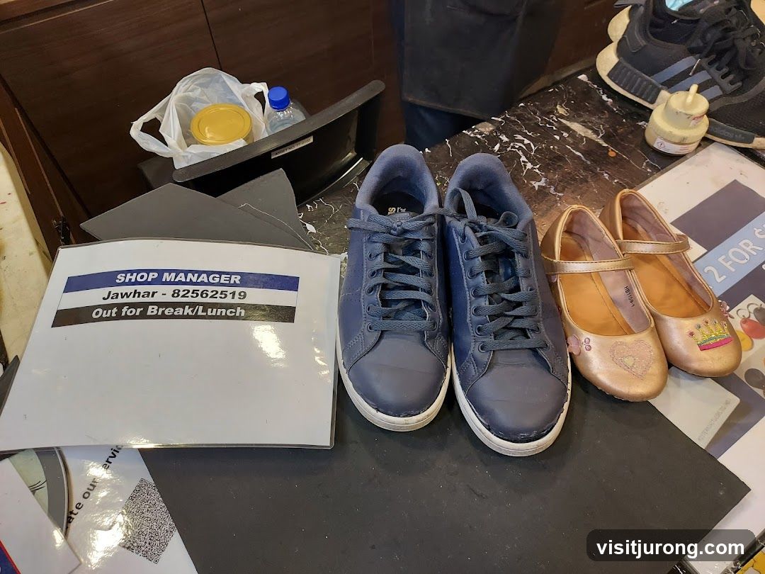 Shoes and Manager Sign