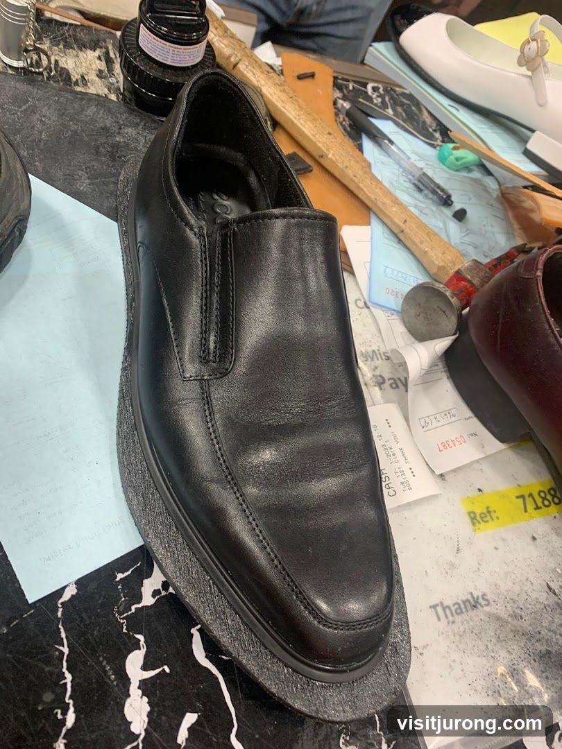 Black Leather Shoe on a Workbench
