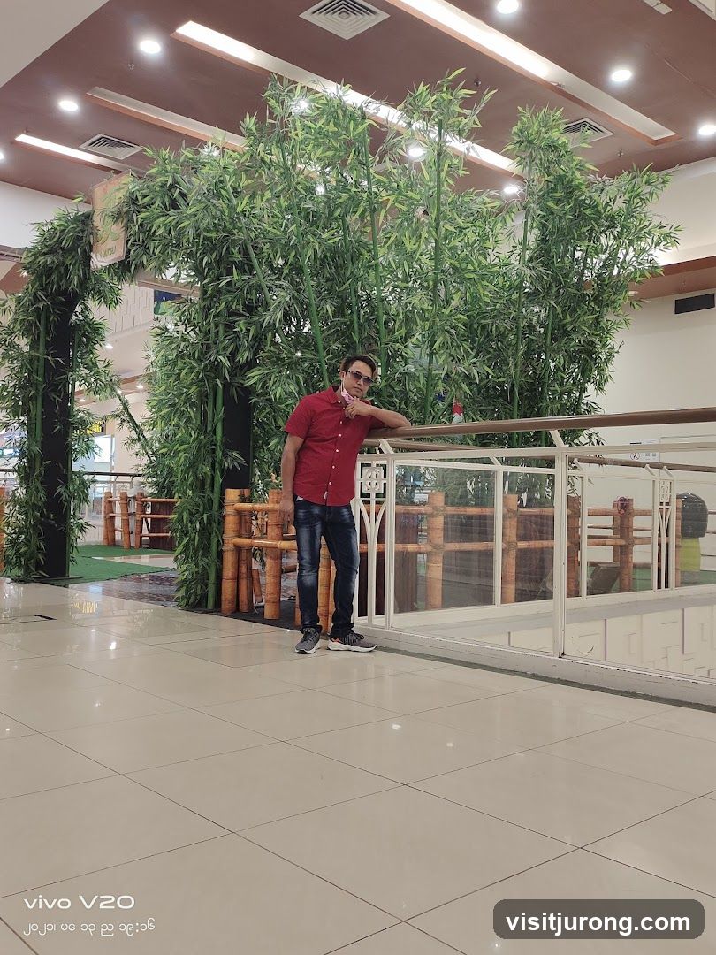 Man Posing by Bamboo Decor