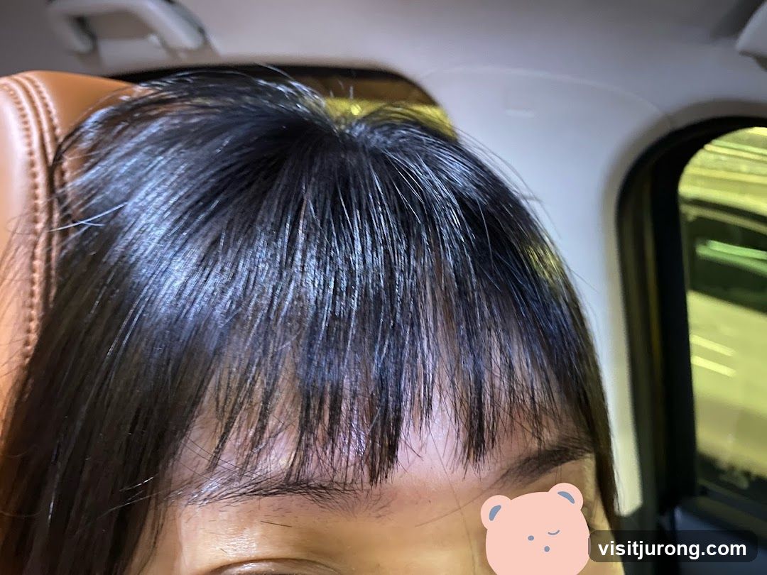 Close-up of a person's hair and eye
