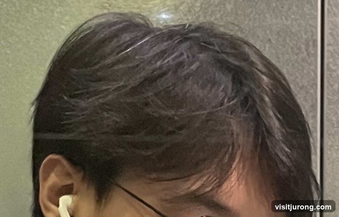 Close-up of person's hair and ear