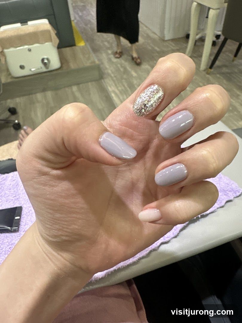 Manicured Hand with Glitter Accent Nail