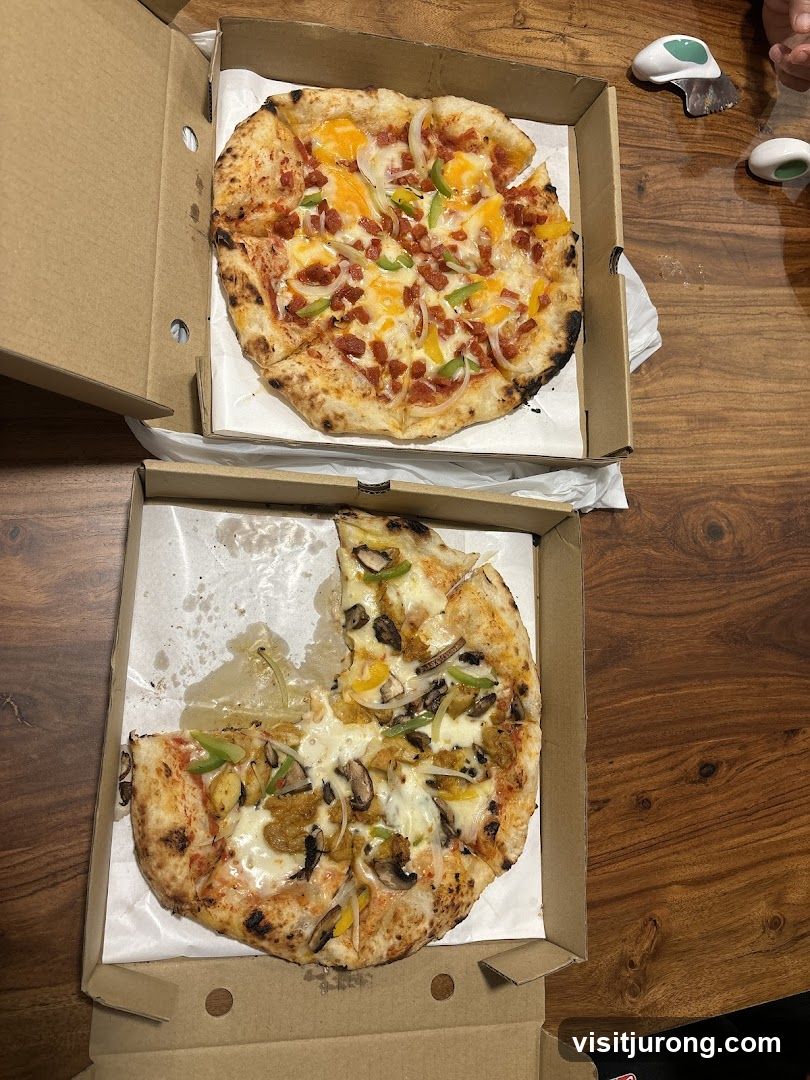 Two Pizzas in Cardboard Boxes