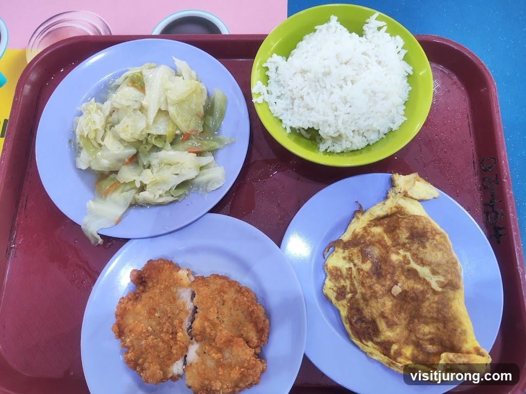 Meal Tray with Rice, Fried Chicken, Omelette, and Cabbage