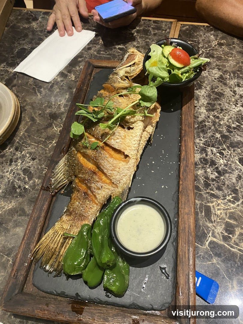 Whole Fried Fish with Salad and Peppers
