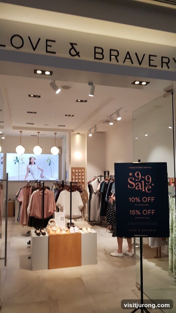 Love & Bravery Store Entrance with Sale Sign