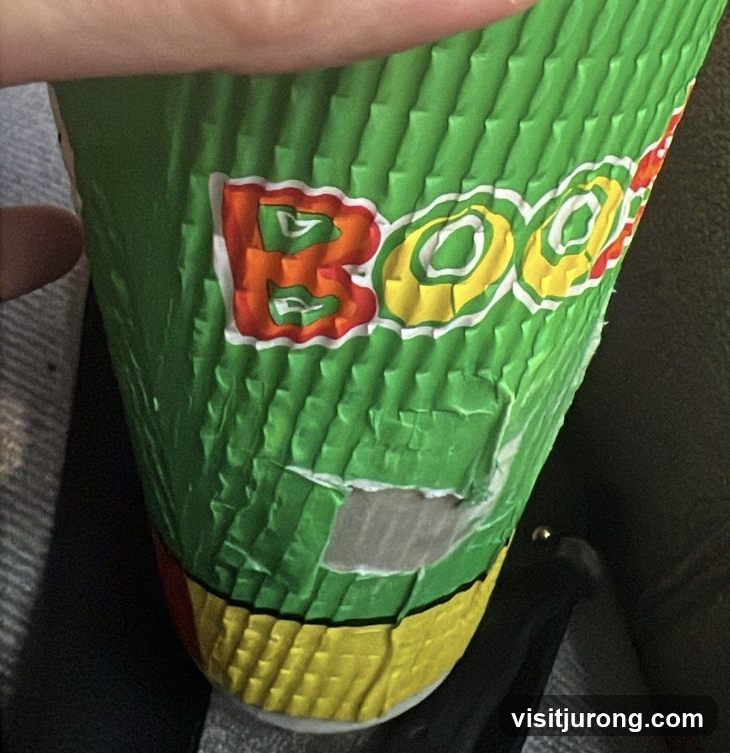 Green cup with colorful logo