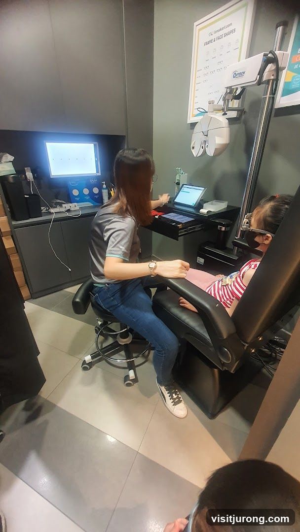 Optometrist examining a child