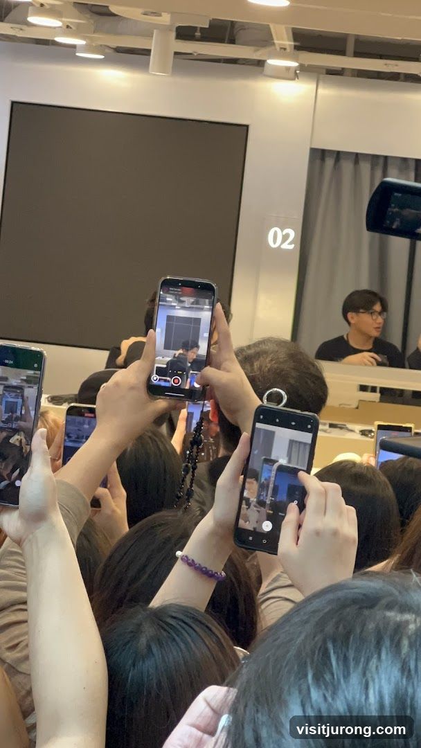 Crowd filming an event