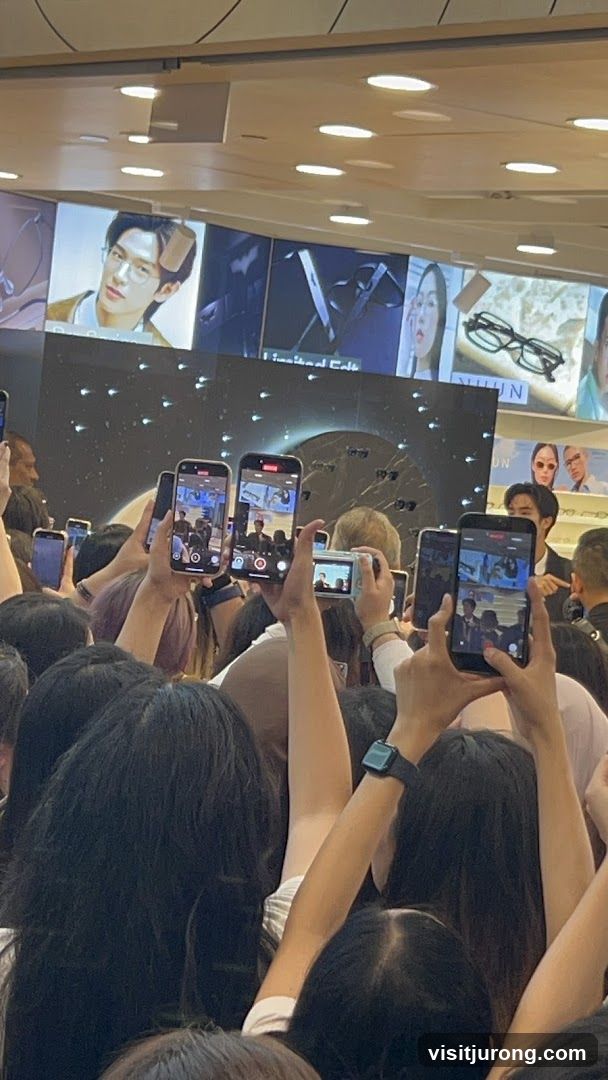 Crowd filming an event