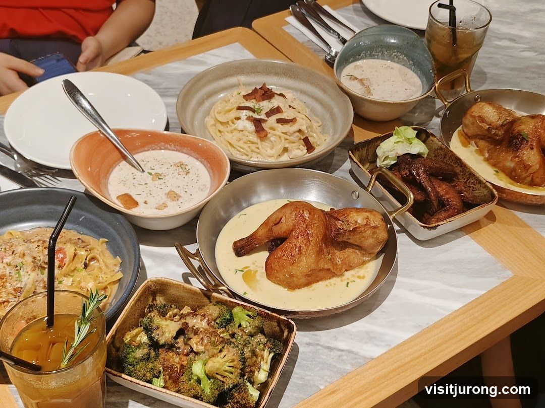 A table laden with various dishes, including pasta, chicken, and soup.