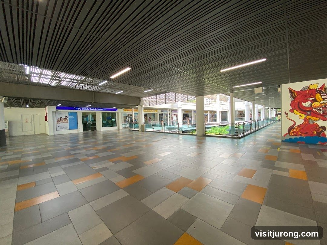 Outdoor walkway with shops and artwork