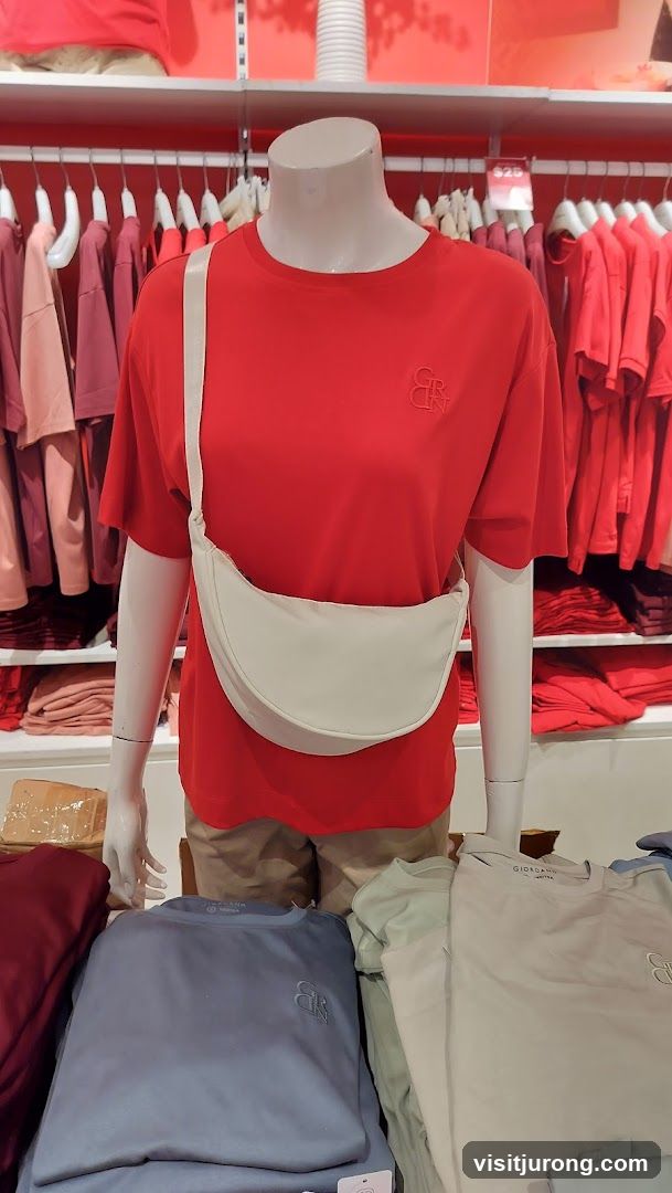 Mannequin wearing red t-shirt and crossbody bag
