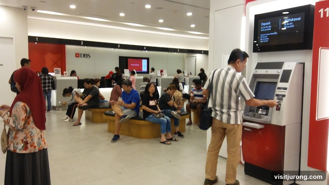 Bank Interior with ATM and Waiting Customers
