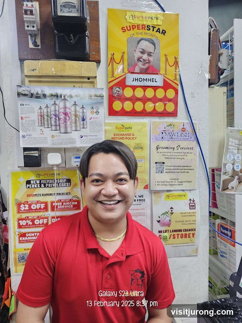Pet Store Employee with Promotional Posters