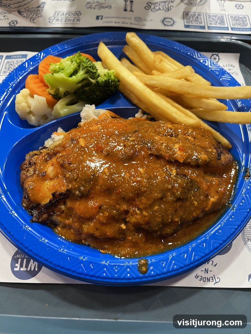 Fish Dish with Fries and Vegetables