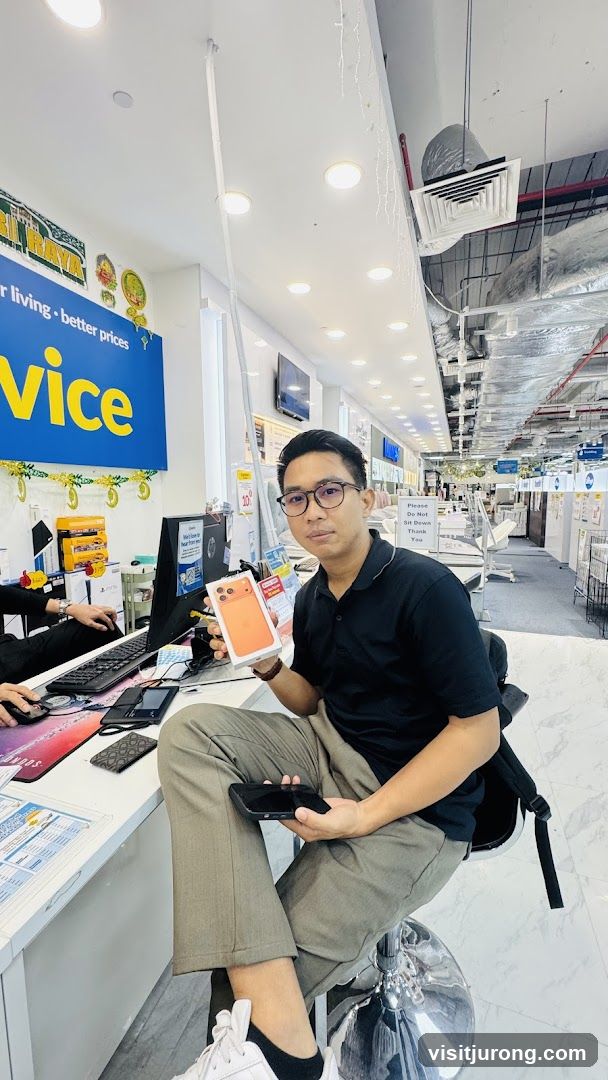Man holding a new phone in a store