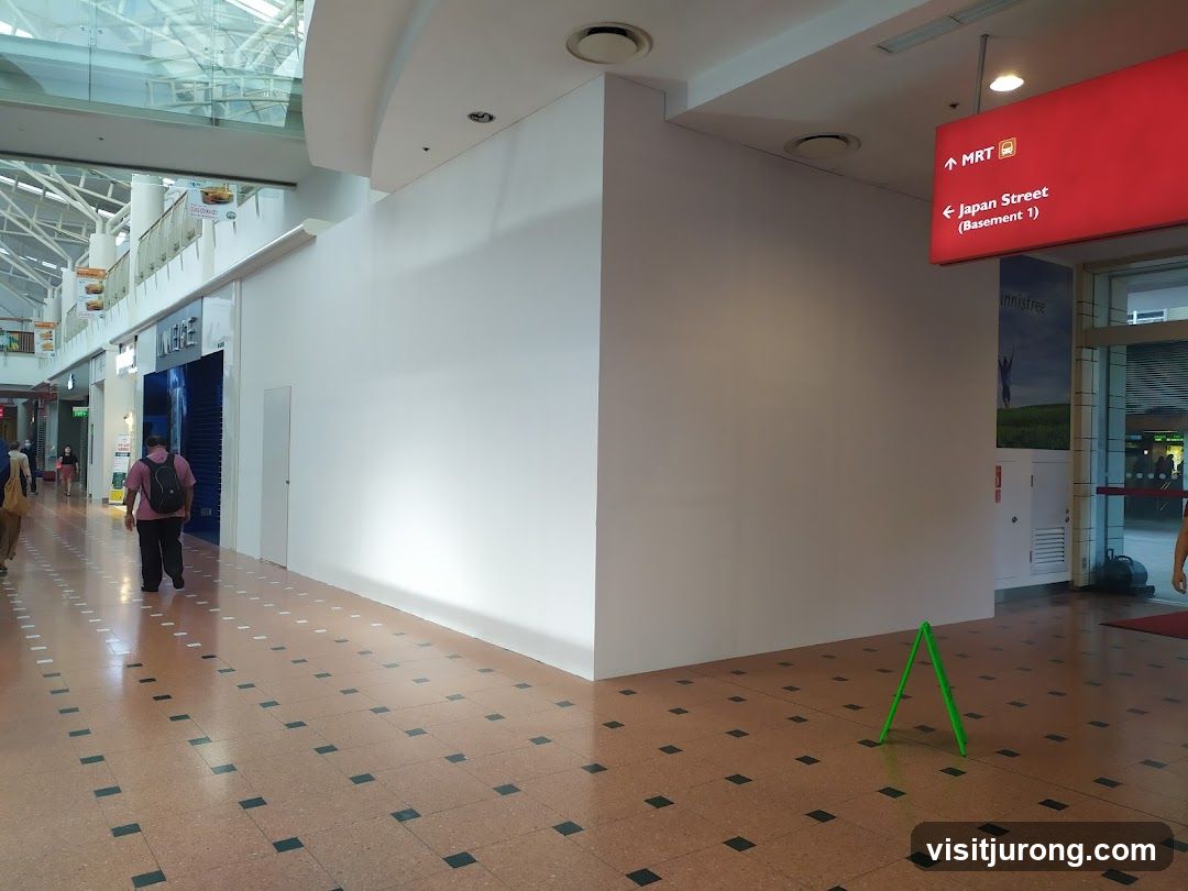 Mall Interior with Storefronts and Signage