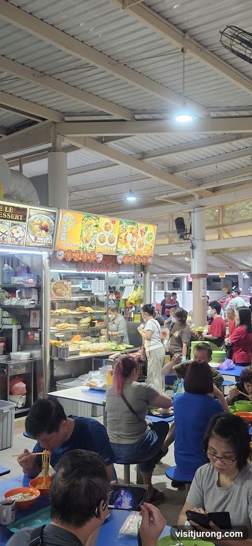 Busy Food Stall with Diners