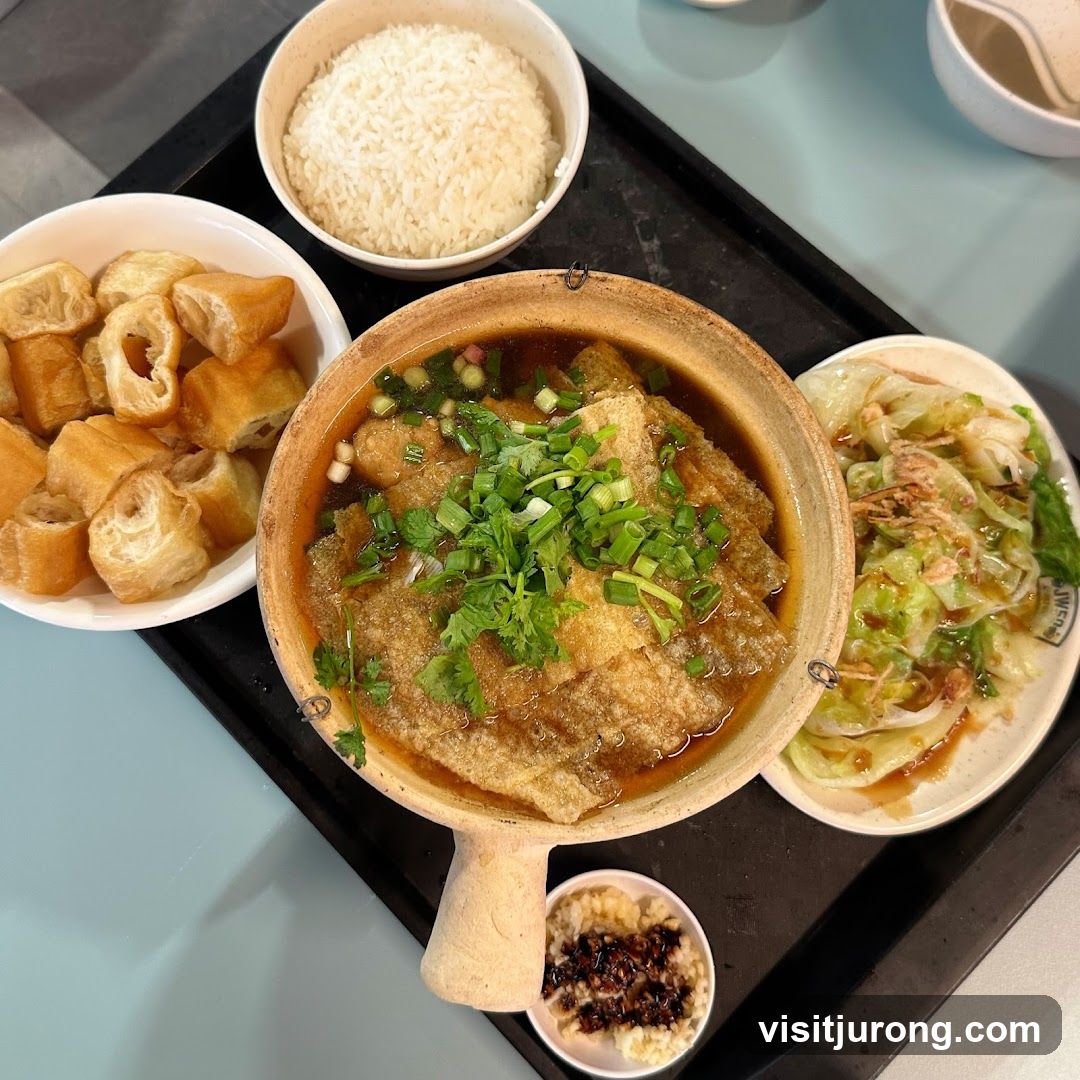 Claypot dish with rice and sides