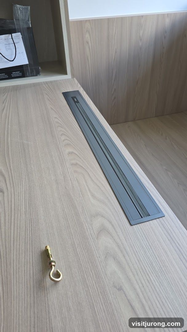 Desk with integrated power outlet and anchor