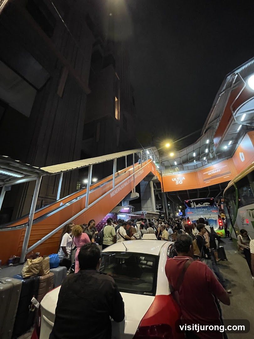 Crowded Bus Station at Night