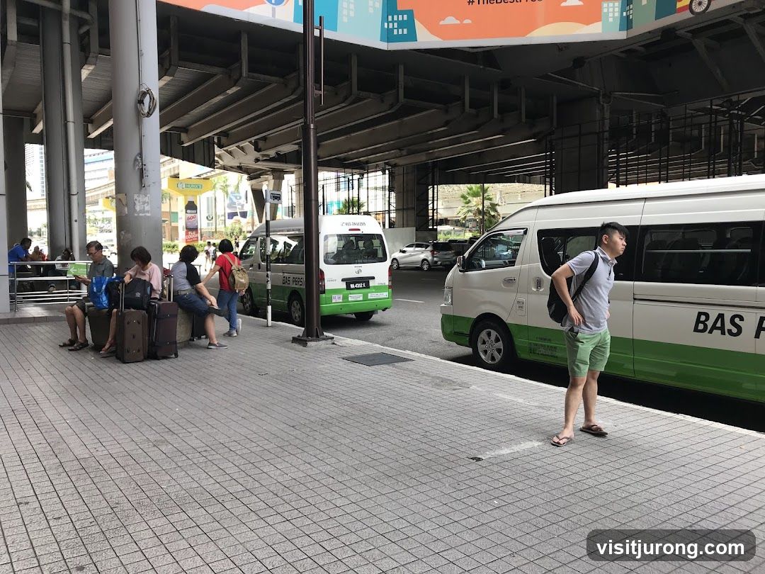 People waiting at a bus stop