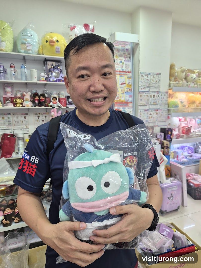 Man Holding Plush Toy in Store