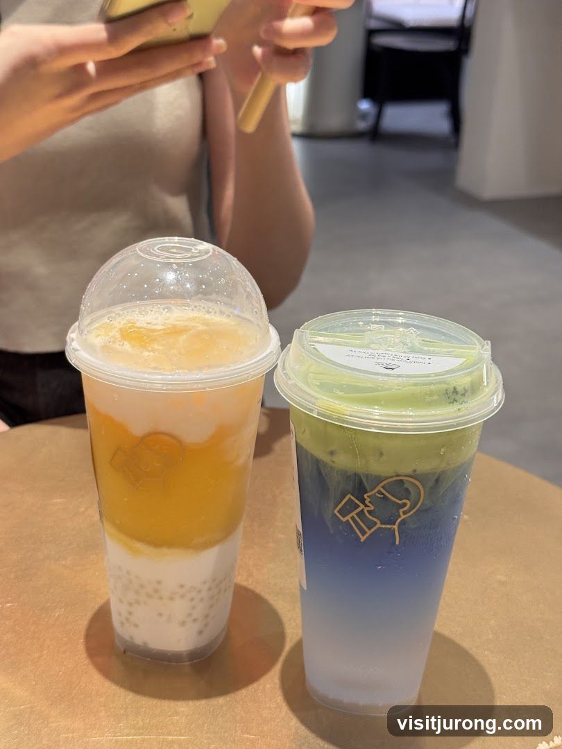 Two colorful drinks on a table
