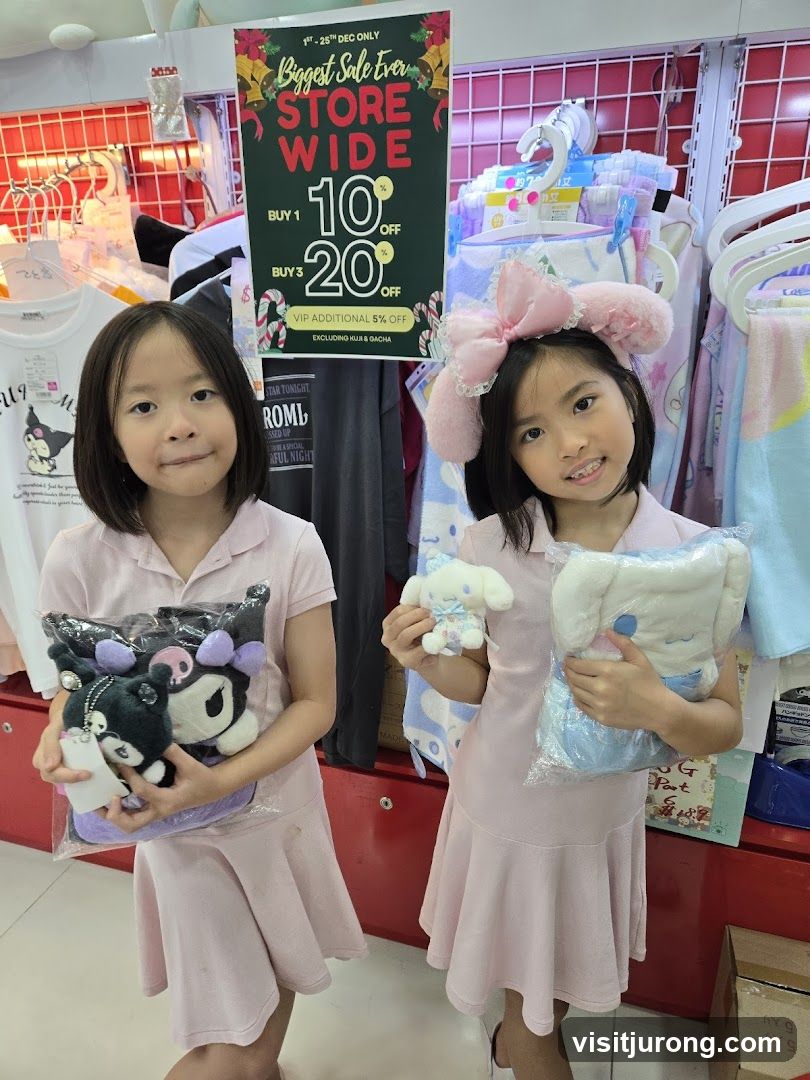 Two girls holding plush toys in a store