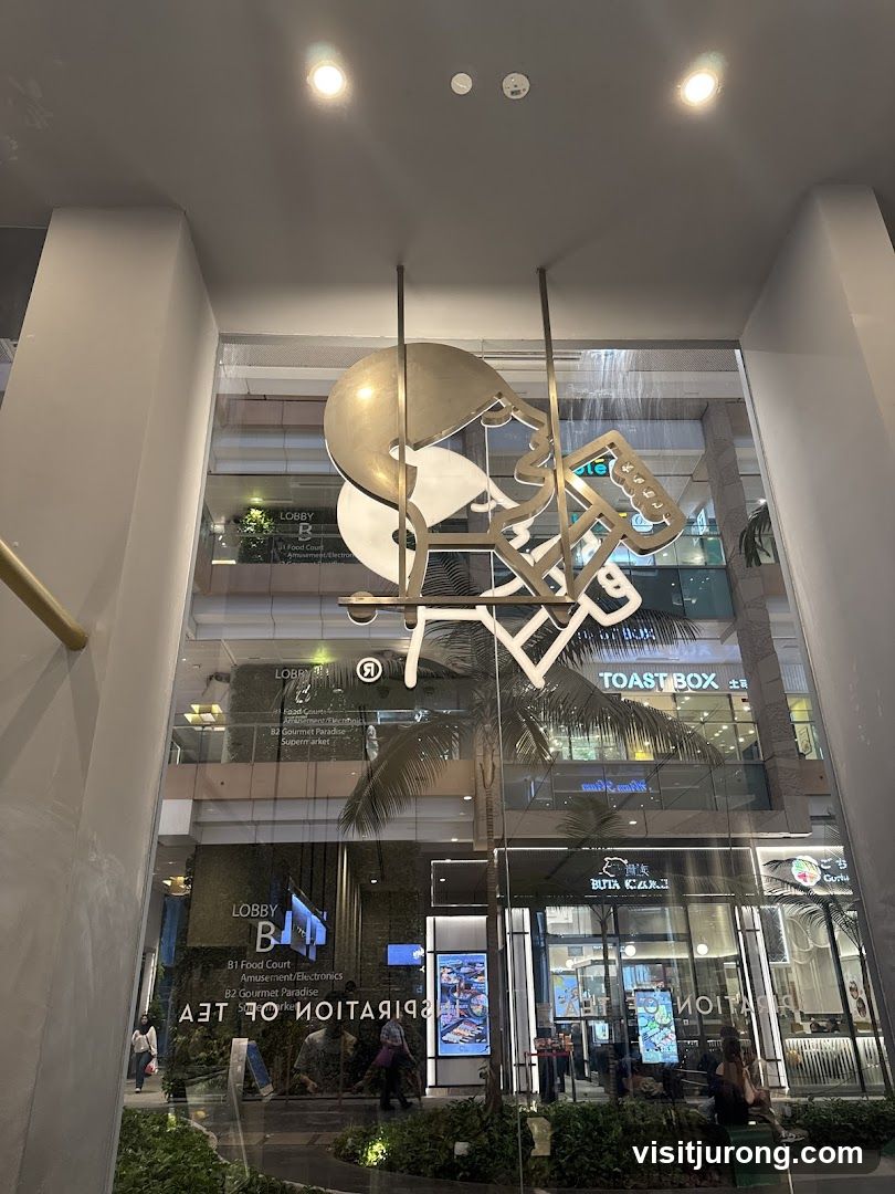 Interior of a shopping mall with a decorative sculpture