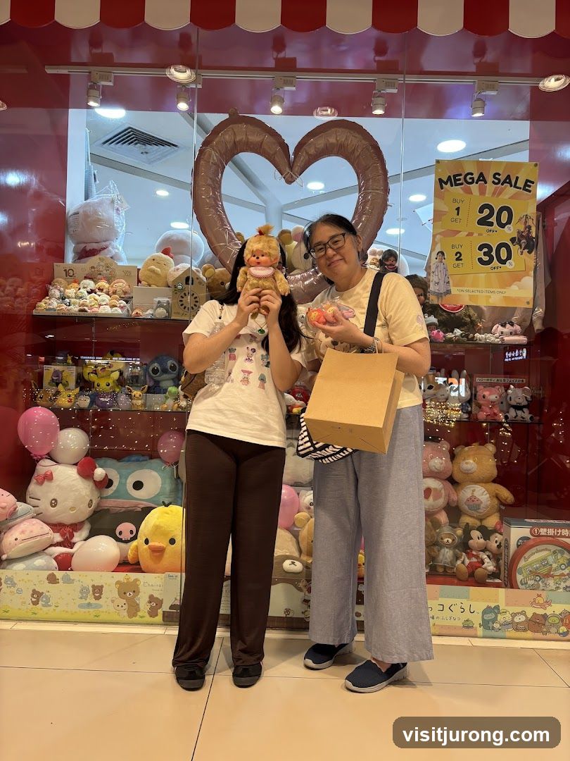 Two people posing in front of a store window filled with plush toys