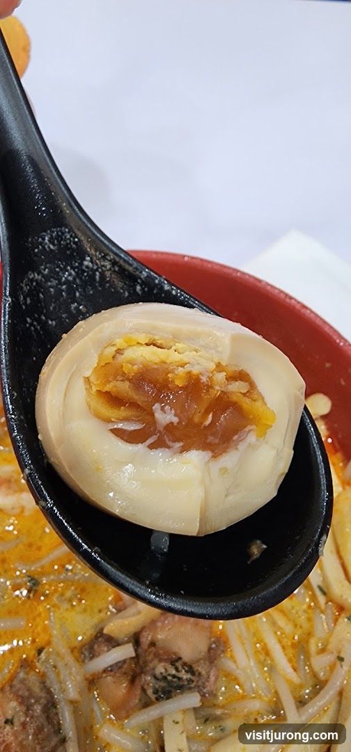 Close-up of a braised egg in a ramen dish