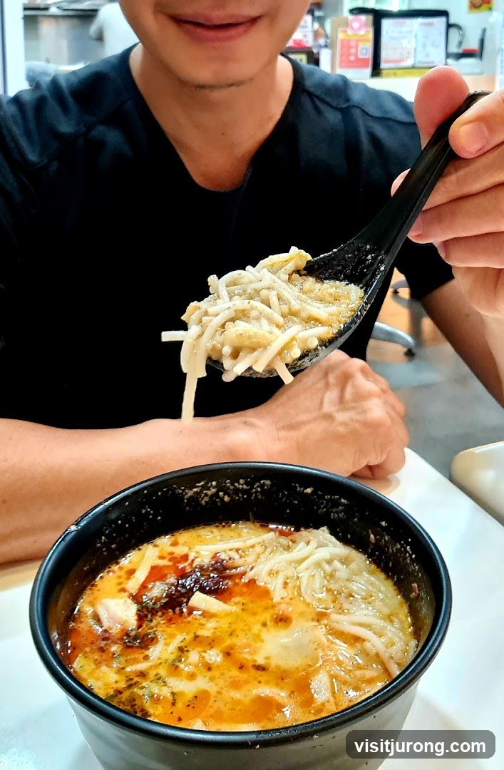 Person eating noodles