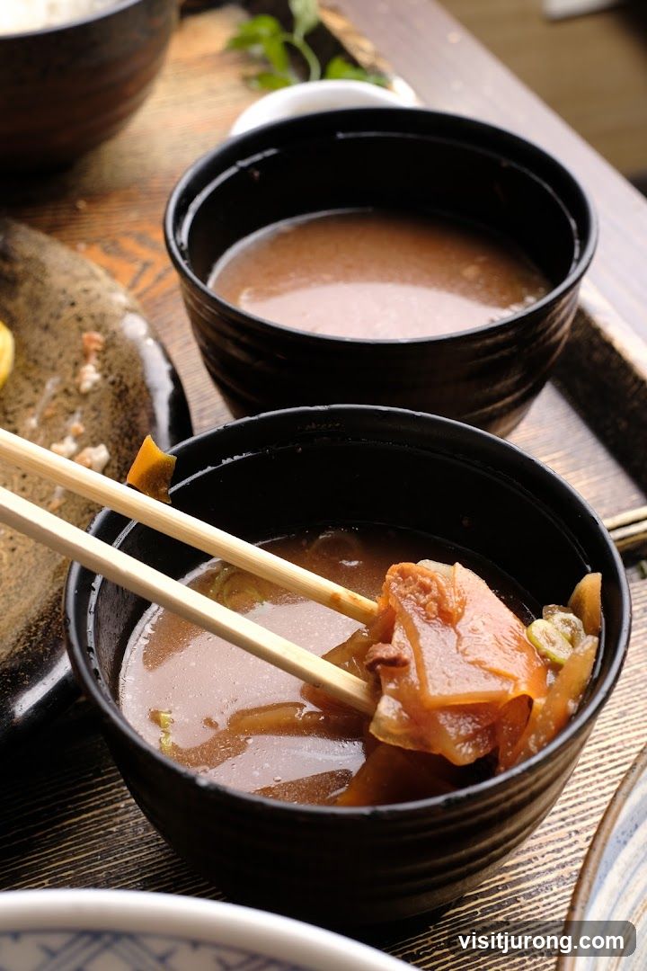 Close-up of a bowl of stew with chopsticks