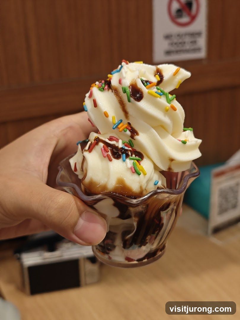 Soft Serve Ice Cream with Sprinkles and Chocolate Syrup