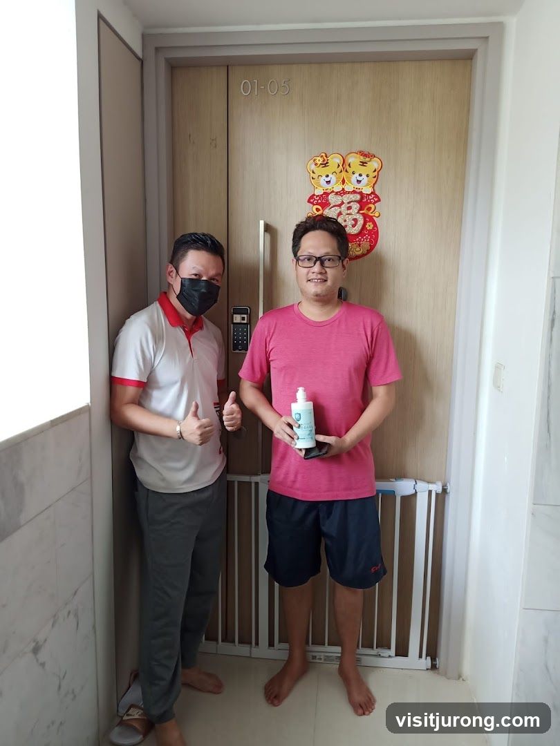 Two men standing by a door
