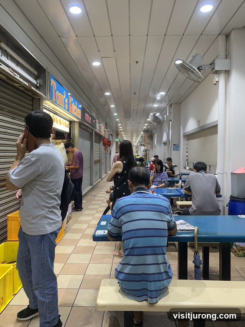 People dining at an outdoor food court