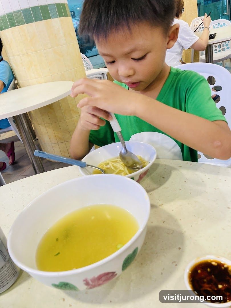 Boy eating noodles