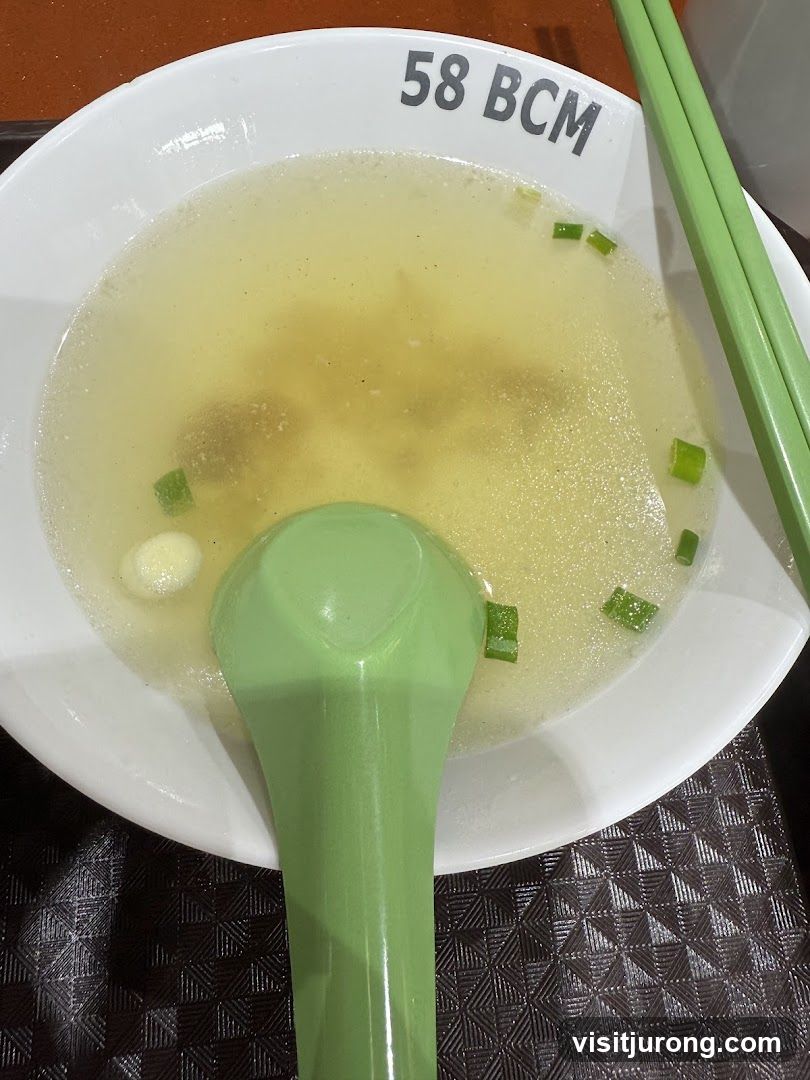 Bowl of Soup with Chopsticks