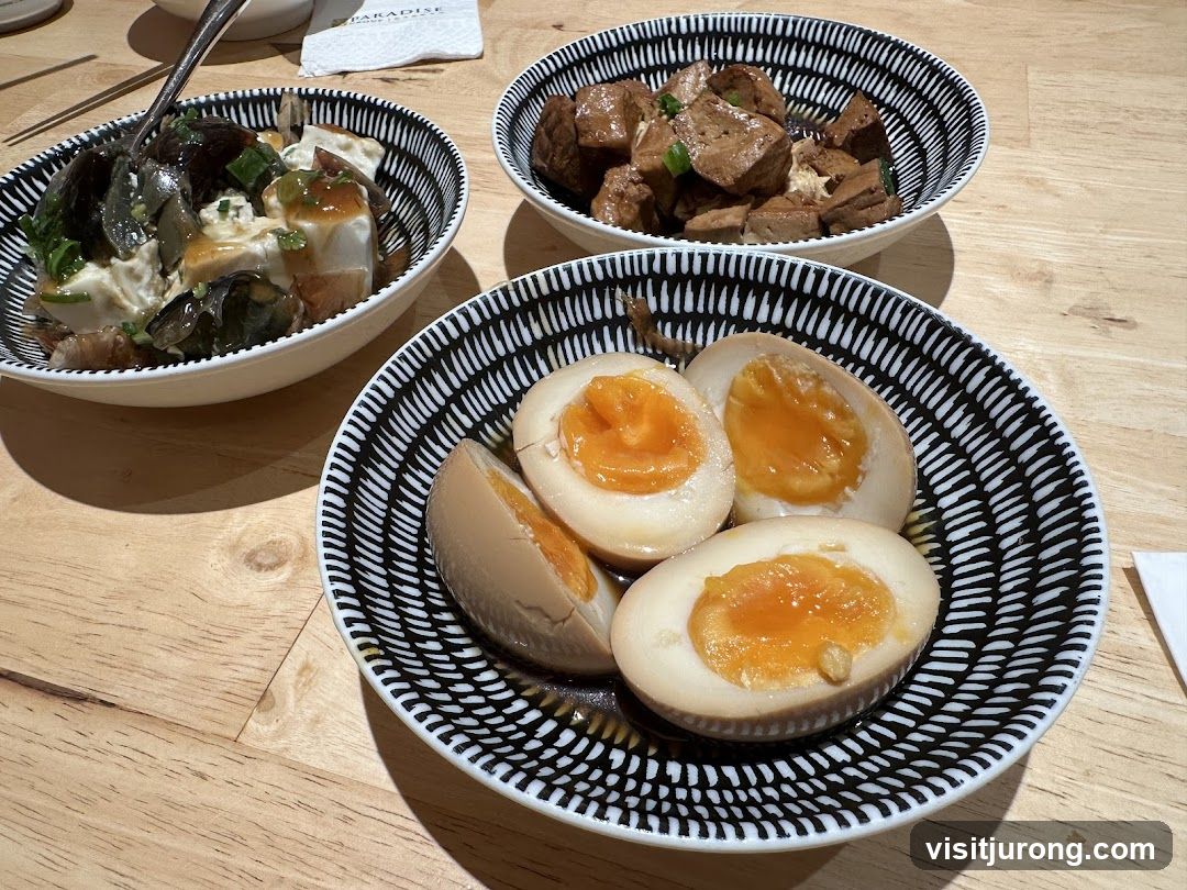 Three bowls of food on a wooden table