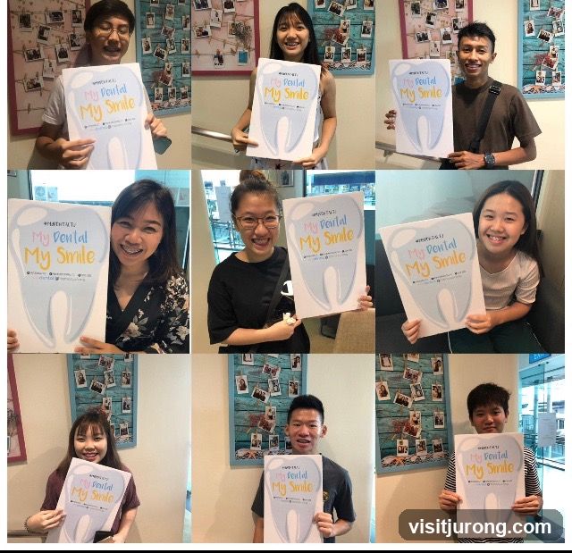 People holding dental posters