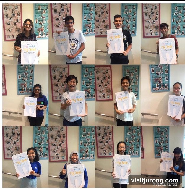Group Posing with Dental Health Signs